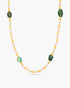 Necklace with green and gold beads on a white background